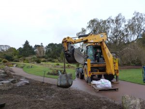 Heavy machinery on iste to shift rocks in to place