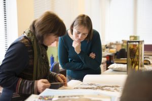 Behind the scenes - Elspeth Haston and Lorna Mitchell looking at potential items to include in the Botanical Treasures publication