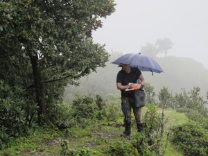Dr. Patrick Kuss working in a monsoon cloud