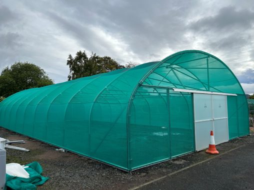 A view of a shade tunnel for growing plants